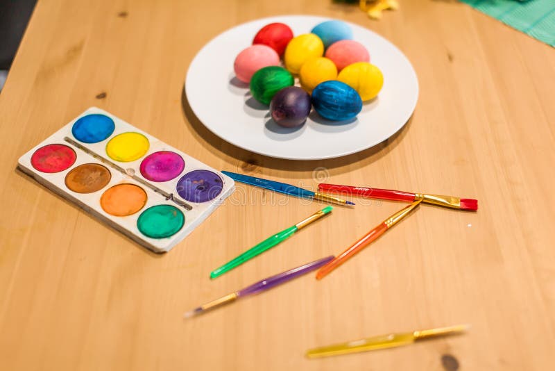 Easter eggs of different bright colors, paints and brushes stock photography Easter eggs of different bright colors, paints and brushes stock photography
