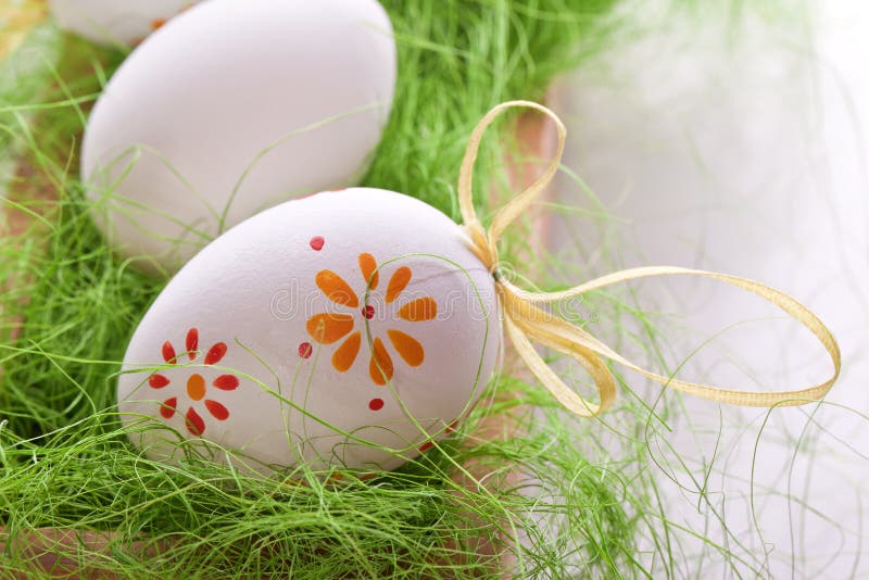 Eggs with with design dots on grass