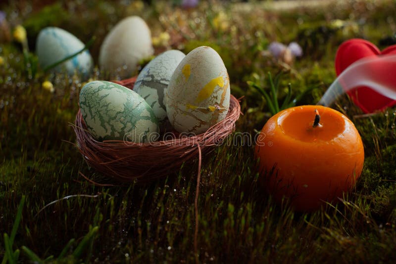 Easter Eggs on Green Moss Background with Blurred Background. Spring