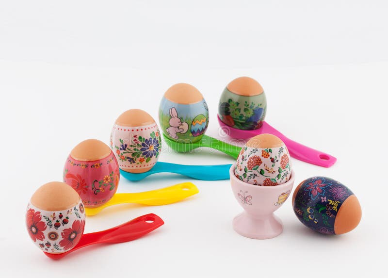 Easter Eggs on Measuring Spoons and White Background Stock Photo