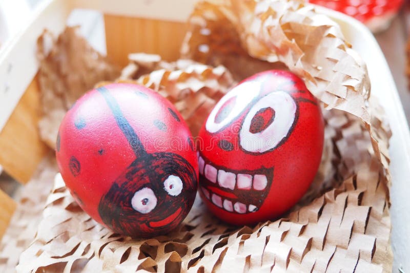 Easter Eggs Painted Red, White and Black with a Cheerful Faces. Boiled