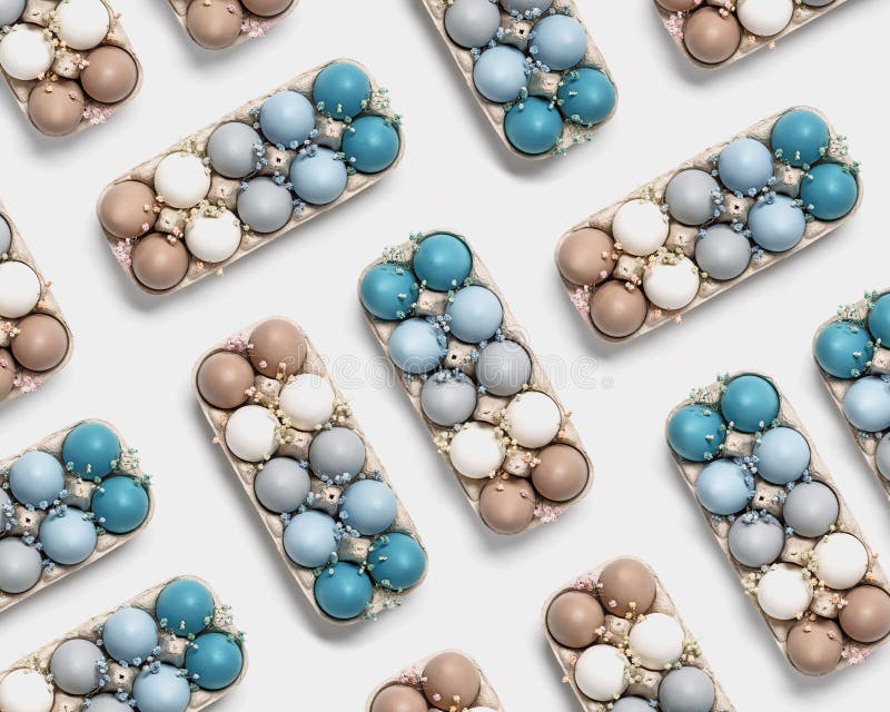 Easter Eggs Pastel Colored in Egg Box Decorated Small Flowers. Minimal