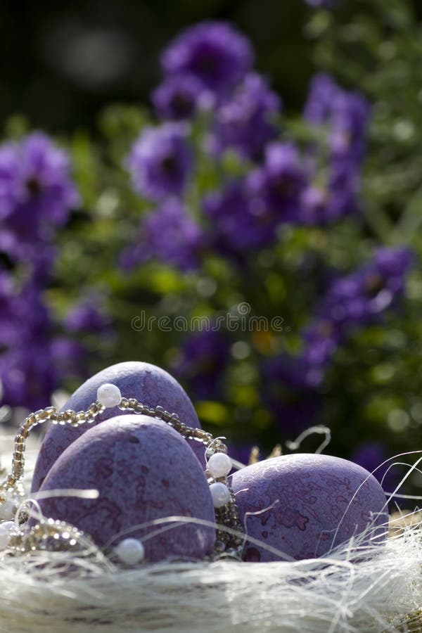 Easter eggs in purple with flowers