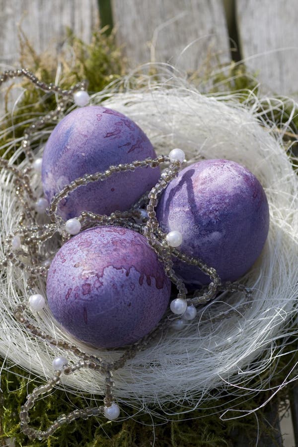 Easter eggs in purple with white pearls