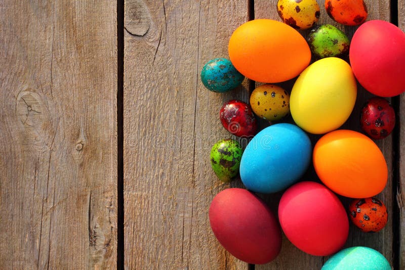 Easter eggs on wooden table. Colorful easter eggs on wood table close up stock photos
