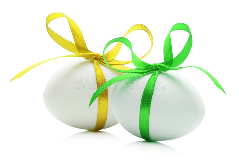 Easter eggs with yellow and green ribbons isolated on the white