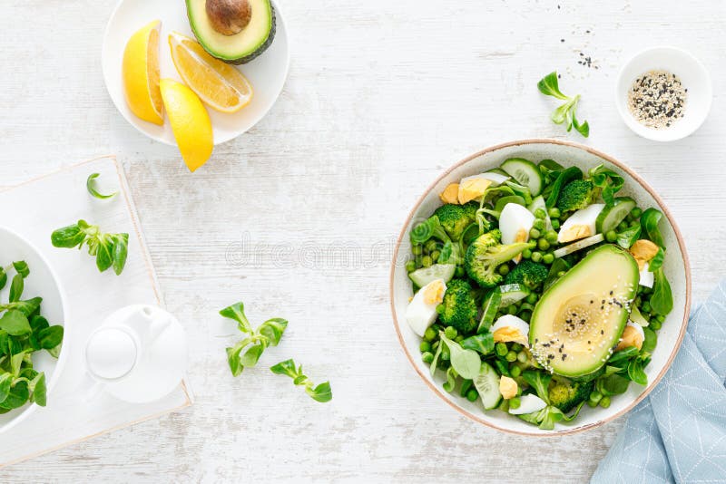 Easter Fresh Vegetable Salad with Boiled Egg, Broccoli, Corn Salad, Green Peas and Avocado Stock