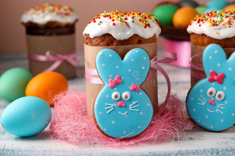 Easter funny rabbits, homemade painted gingerbread biscuits in glaze and Easter cakes, colorful eggs stock photo Easter funny rabbits, homemade painted gingerbread biscuits in glaze and Easter cakes, colorful eggs stock photo