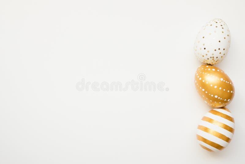 Easter golden decorated eggs isolated on white background. Minimal easter concept. Happy Easter card with copy space for text.