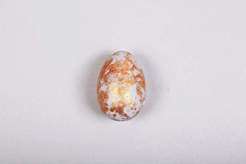 Easter gray golden egg on gray background. Easter concept. Minimalism. Top view, flatlay royalty free stock photography Easter gray golden egg on gray background. Easter concept. Minimalism. Top view, flatlay royalty free stock photography