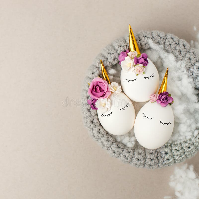 Easter holiday concept with cute handmade eggs, unicorns decor in bird nest. Easter holiday concept with cute handmade eggs, cute sleepy unicorns decor in bird royalty free stock photo Easter holiday concept with cute handmade eggs, unicorns decor in bird nest. Easter holiday concept with cute handmade eggs, cute sleepy unicorns decor in bird royalty free stock photo