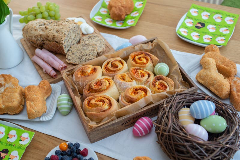 Easter holiday table. Easter cakes and colored eggs on a wooden table stock photo