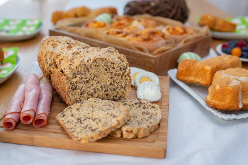 Easter holiday table. Easter cakes and colored eggs on a wooden table stock images