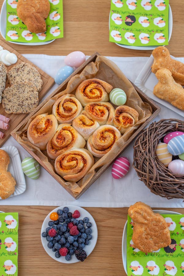 Easter holiday table. Easter cakes and colored eggs on a wooden table royalty free stock image