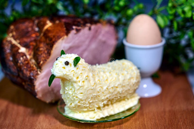 Easter Lamb with Butter, Ham and Egg on a Wooden Table Stock Photo
