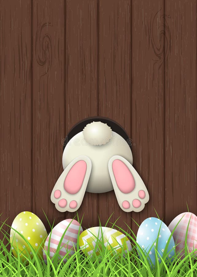 Easter motive, bunny bottom and easter eggs in fresh grass on brown wooden background, illustration