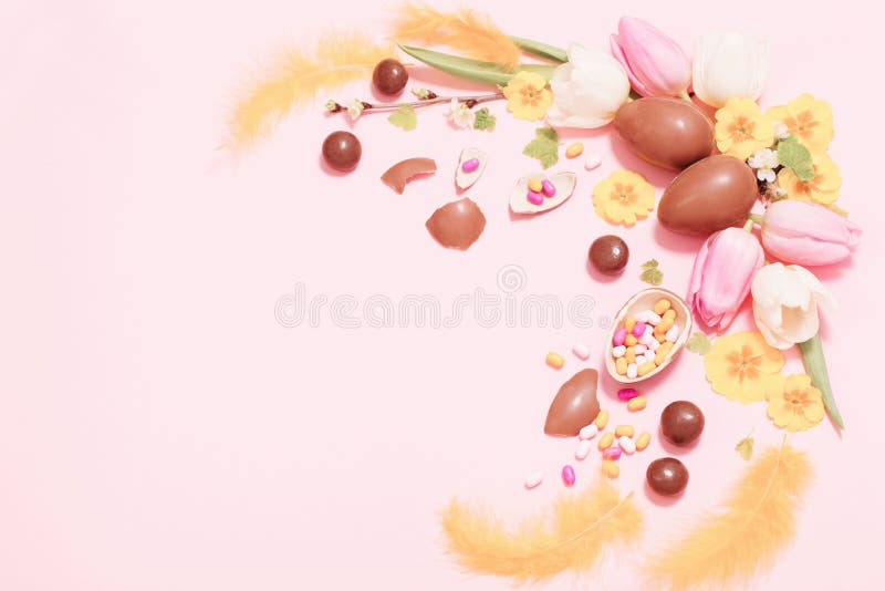 Easter pink background with eggs and flowers