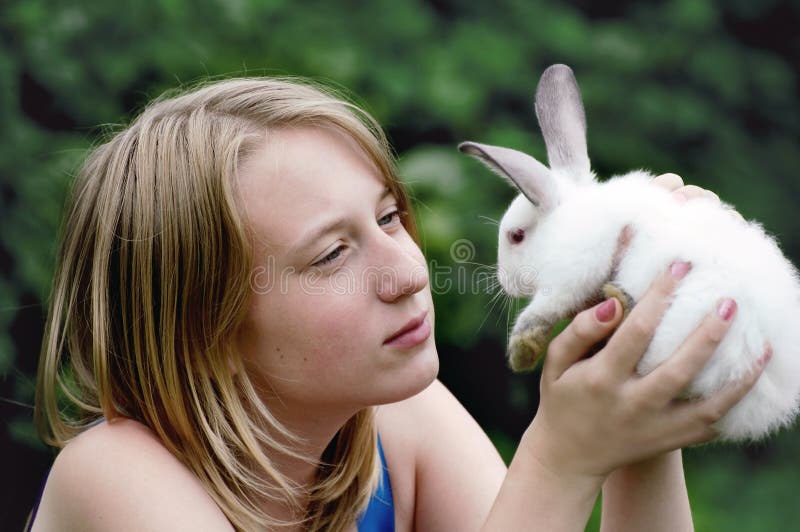 Easter rabbit in hands of the young girl