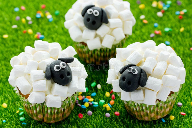 Easter sheep cupcakes on green grass background royalty free stock photo Easter sheep cupcakes on green grass background royalty free stock photo