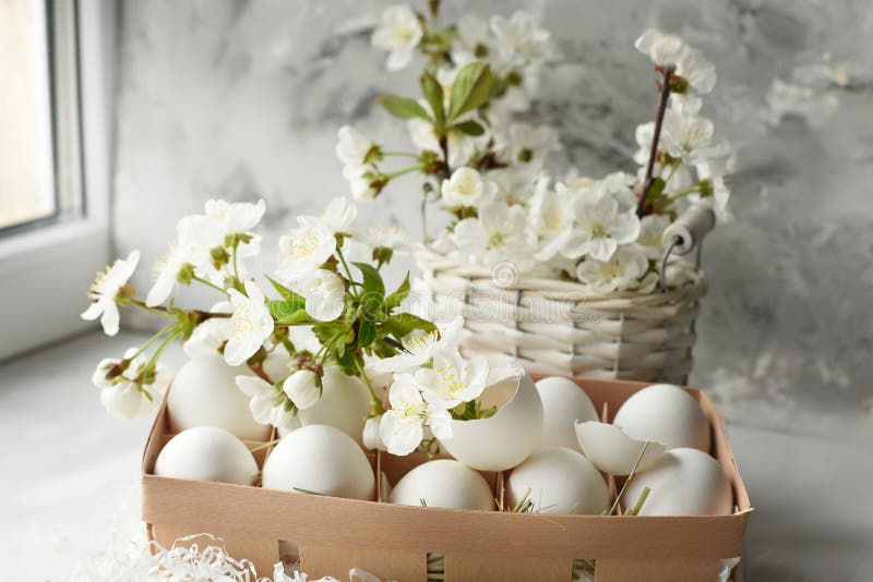 Easter still life. Gentle bright photo of egg and cherry blossoms. stock photos