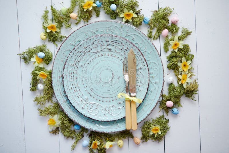 Easter Table Setting with Flowers and Eggs. Empty Decorative Ceramic