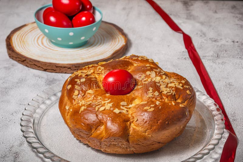 Easter Traditional Bread, Greek Tsoureki and Red Eggs on a Table Stock