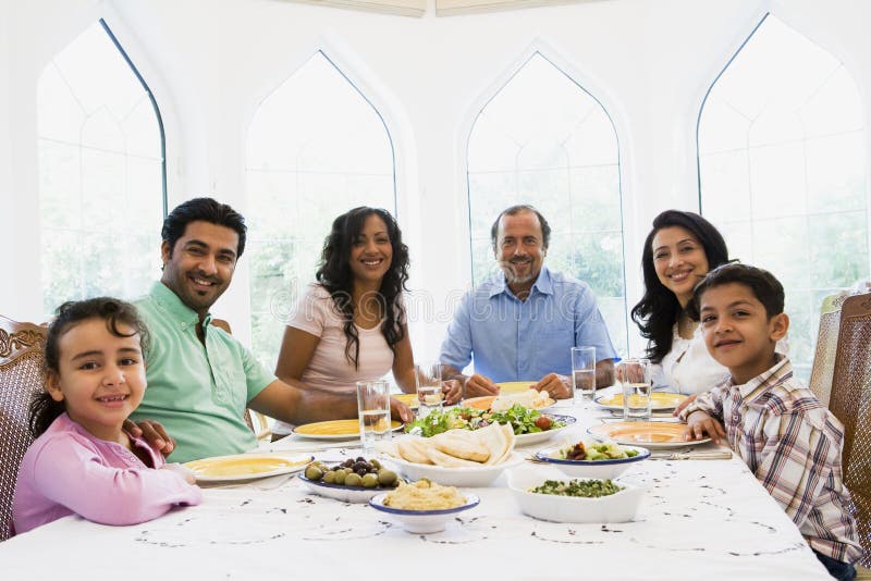 eastern enjoying family meal middle together στοκ εικόνες eastern enjoying family meal middle together στοκ εικόνες