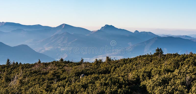 Eastern part of Mala Fatra mountains with Stoh and Velky Rozsutec hills from Velky Choc hill in Chocske vrchy mountains in