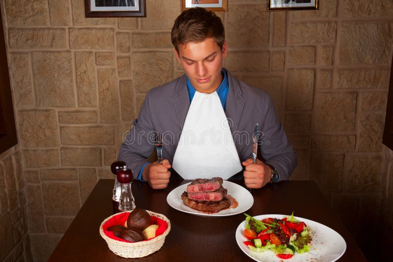 Eat a beef steak stock image. Image of adult, lunch, bite 32293309
