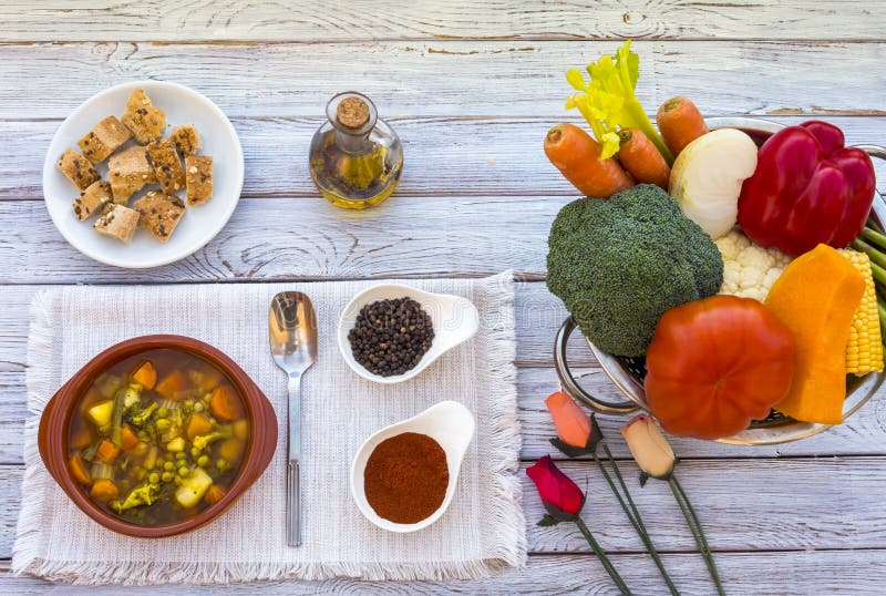 Eat healthy - fresh homemade vegetable soup. Made with carrots, potatoes, peas, celery and broccoli. Raw vegetables - diet -. Wooden table, and croutons stock images Eat healthy - fresh homemade vegetable soup. Made with carrots, potatoes, peas, celery and broccoli. Raw vegetables - diet -. Wooden table, and croutons stock images