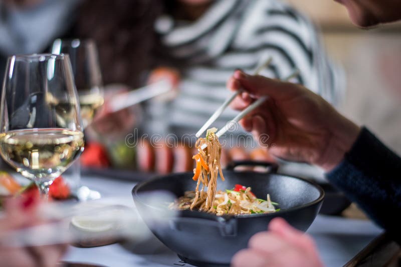 Eat noodles with chopsticks stock photo Eat noodles with chopsticks stock photo