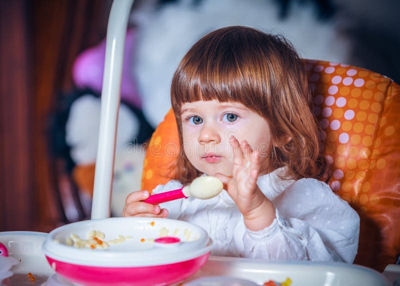 Boy Eating Baby Food with Spoon Stock Photo - Image of little