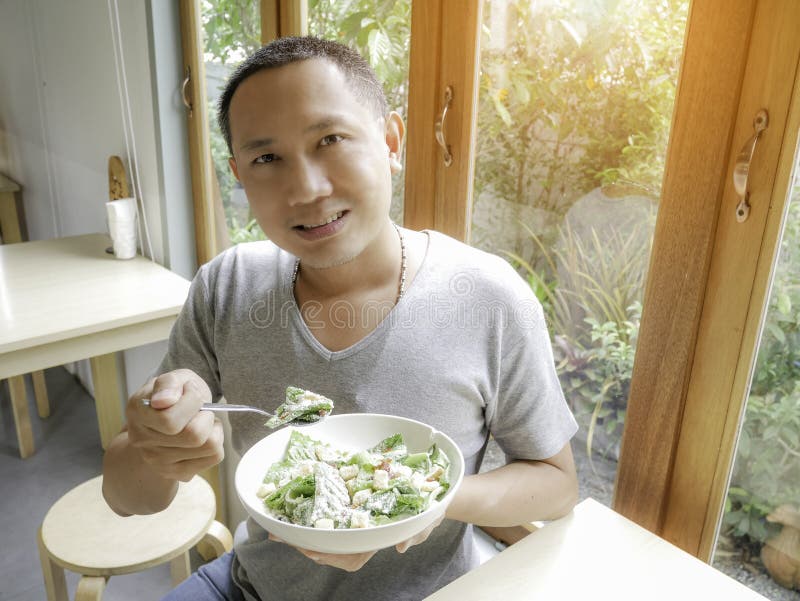 Eating caesar salad stock photo. Image of crisp, meal 95648932