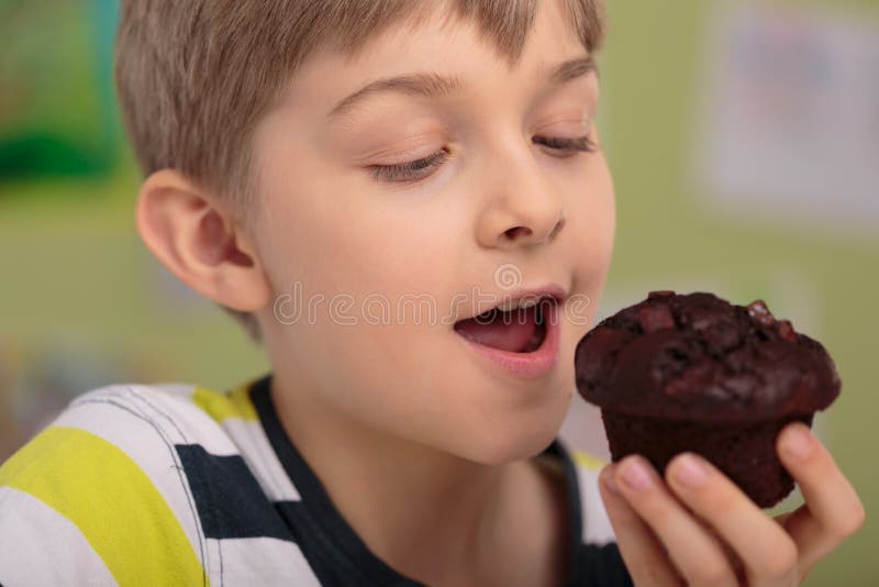 Eating delicious cupcake stock photo. Image of child 55833822