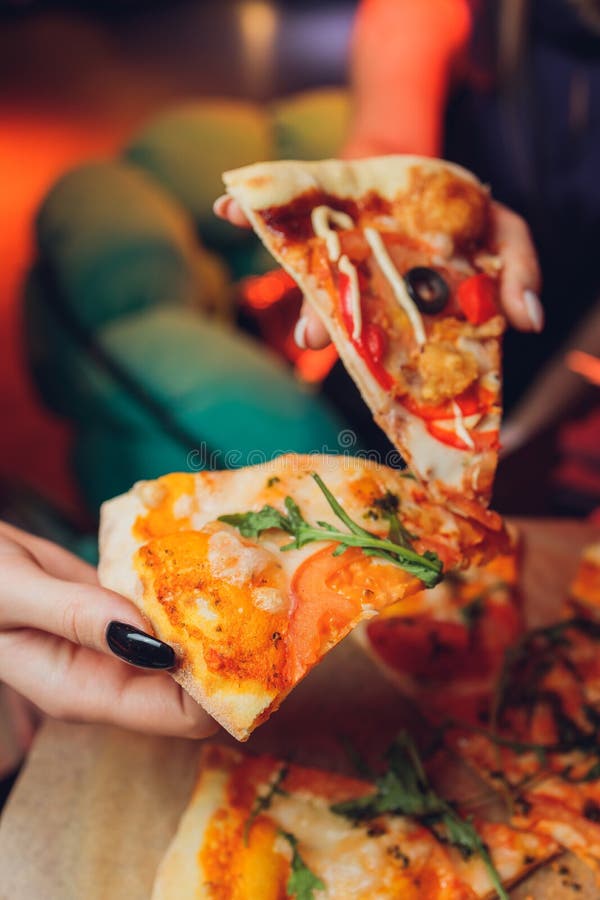 Eating Pizza. Group Of Friends Sharing Pizza Together. People Hands Taking  Slices Of Pepperoni Pizza. Fast Food, Friendship, Leisure, Lifestyle. Stock  Photo