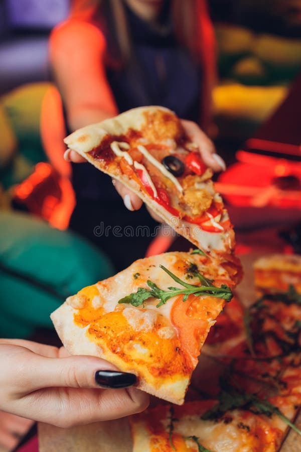 Eating Pizza. Group Of Friends Sharing Pizza Together. People Hands Taking  Slices Of Pepperoni Pizza. Fast Food, Friendship, Leisure, Lifestyle. Stock  Photo