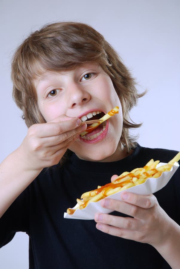 Eating french fries stock photo. Image of hand, portrait 17019372