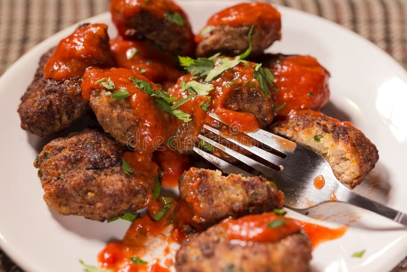 Eating Fried Meatballs Made from Pork and Beef Meat with Tomato Stock ...