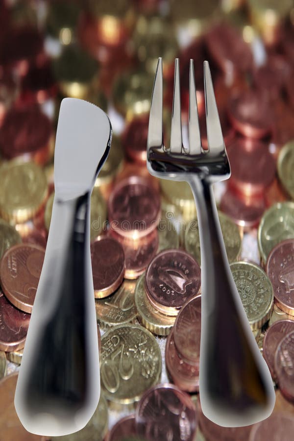 Eating out knife and fork isolated in money