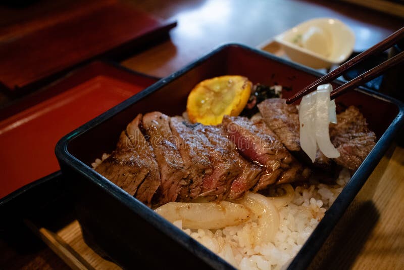 Eating Perfectly Cooked Steak in Highclass Japanese Restaurant Stock