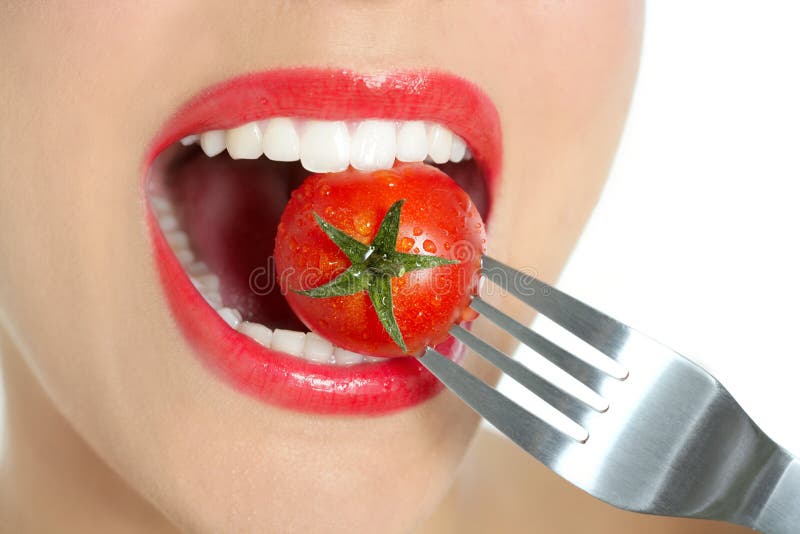 Eating A Red Tomato Macro Of Woman Mouth Royalty Free Stock Photography