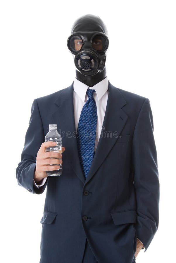 Man in business suit holding a bottle of water. Man in business suit holding a bottle of water