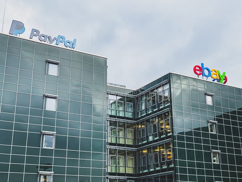 EBay American multinational e-commerce corporation and PayPal American company operating online payments system logo at the companies office building located in Potsdam, Germany - February 18, 2020. EBay American multinational e-commerce corporation and PayPal American company operating online payments system logo at the companies office building located in Potsdam, Germany - February 18, 2020