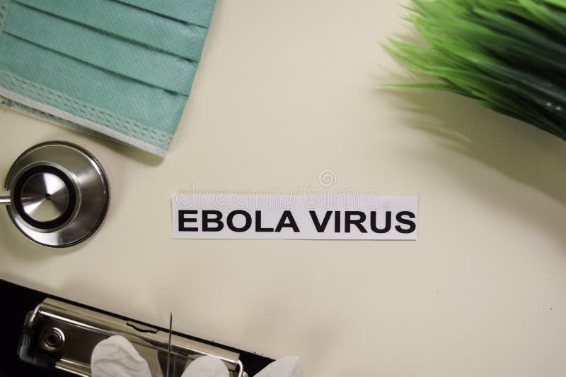 Ebola virus med inspiration och sjukvård/medicinskt begrepp på skrivbordbakgrund arkivfoto Ebola virus med inspiration och sjukvård/medicinskt begrepp på skrivbordbakgrund arkivfoto