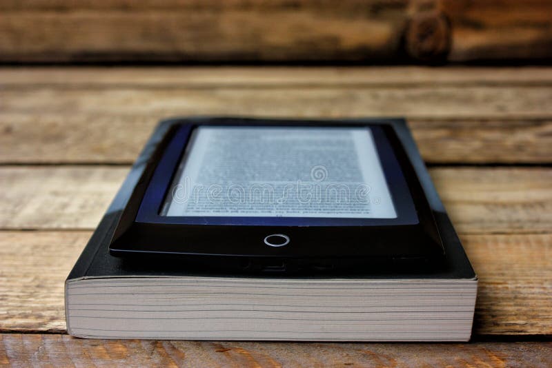 Ebook vs book stock photo. Image of online, concept, holding 72033568