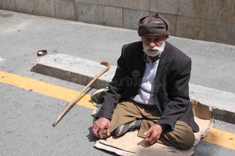 Beggar asking for money from passers in Bucharest,romania. Beggar asking for money from passers in Bucharest,romania