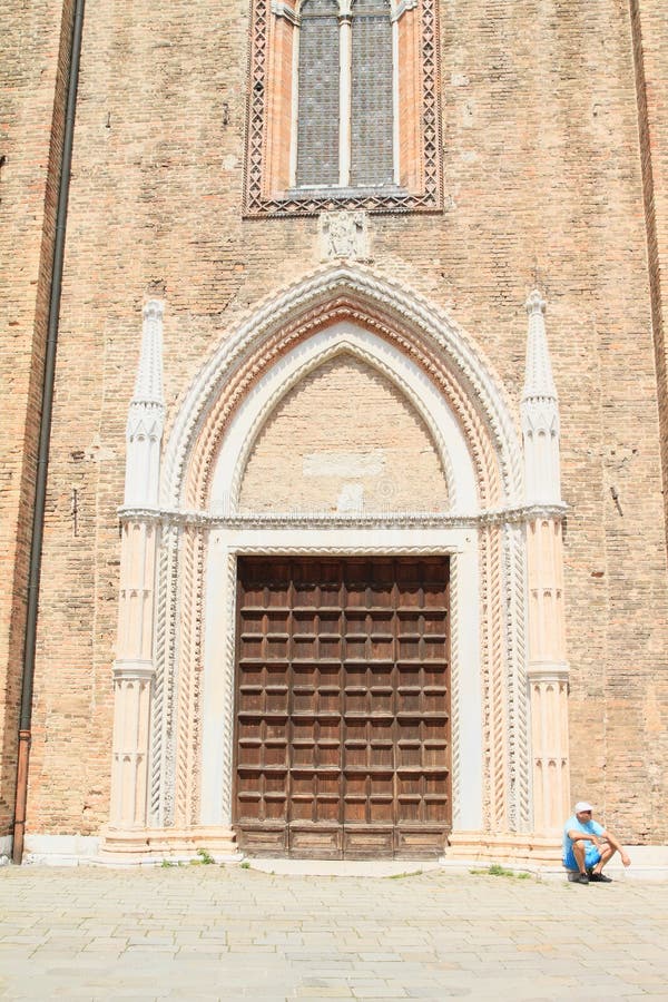 Beggar sitting in front of door to church in Venice (Italy). Beggar sitting in front of door to church in Venice (Italy)