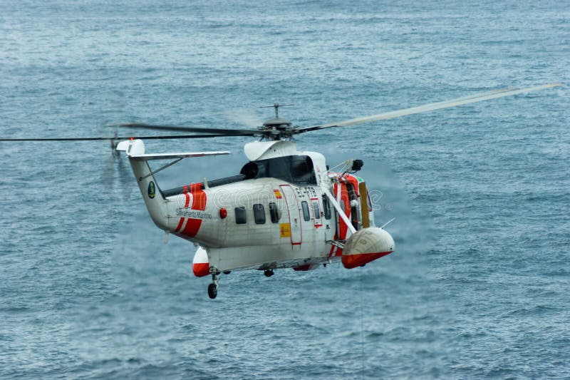An ec225 Super Puma helicopter flies over the sea