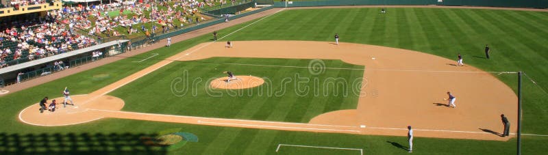 A view of a baseball pitch from the crowd. A view of a baseball pitch from the crowd.