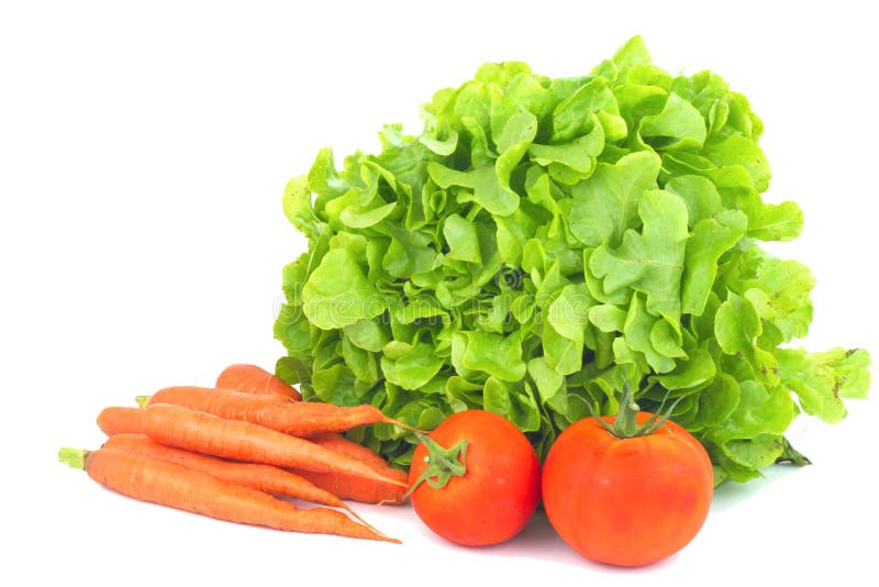 Echte organische groentenwortelen, groene salade, geïsoleerde tomaten royalty-vrije stock foto Echte organische groentenwortelen, groene salade, geïsoleerde tomaten royalty-vrije stock foto